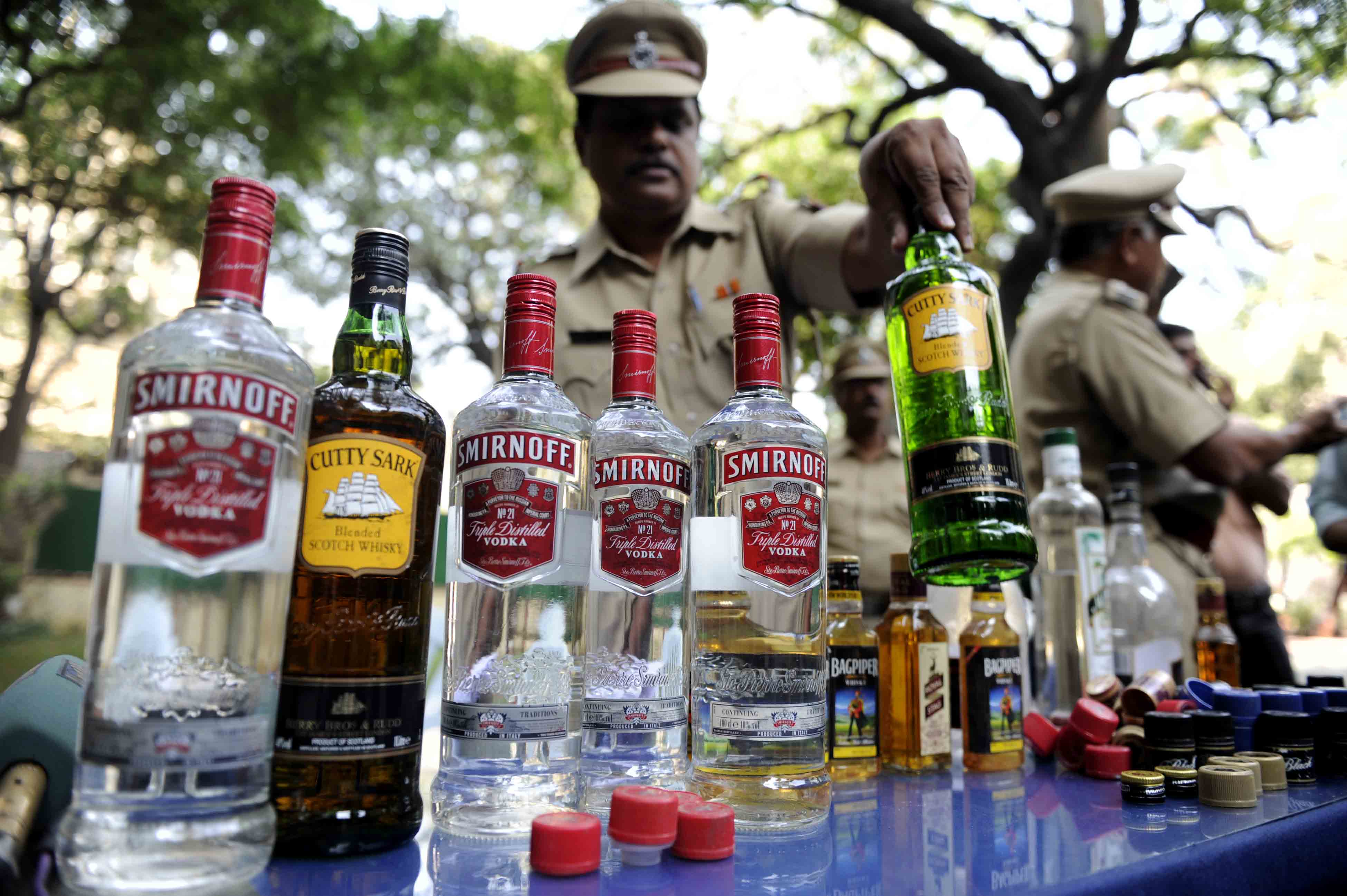 An officer checks the siezed liquor worth 96,780 by excise department and arrested two person in Mumbai on Wenesday - Salman Ansari.DNA
